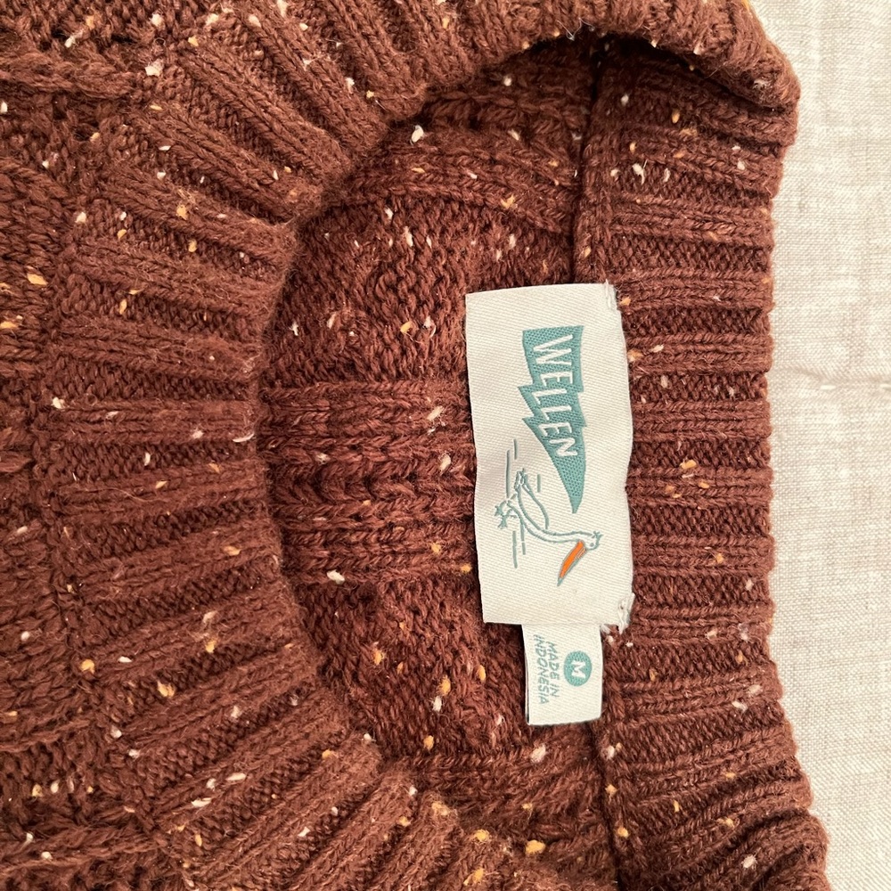 Wellen Seawool Sweater. The color is more of a rust. Like new!
